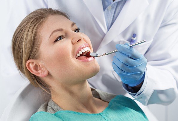 Woman receiving dental exam