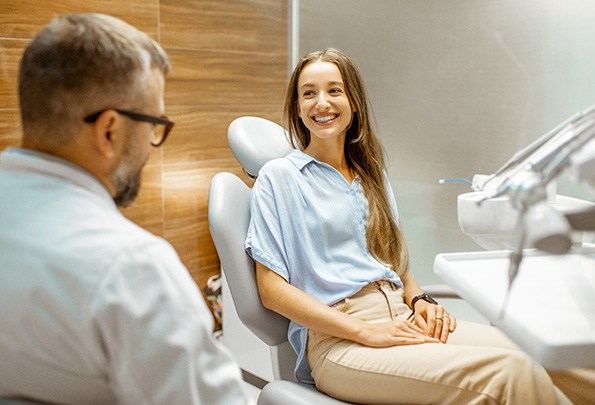 Lady smiles at dentist
