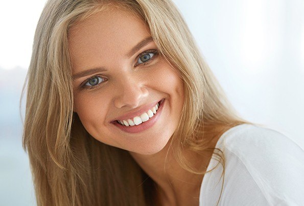 Woman with flawless smile after cosmetic dentistry