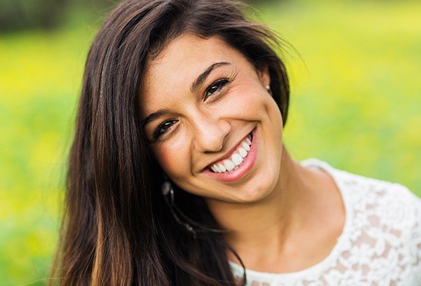 Woman with healthy smile after gum recontouring