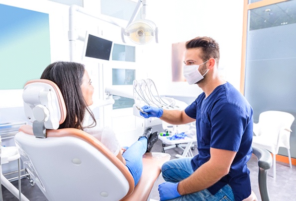 Woman at consultation for full mouth restoration in Everett