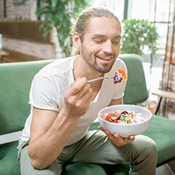 Man eating vegetables and salad in Everett