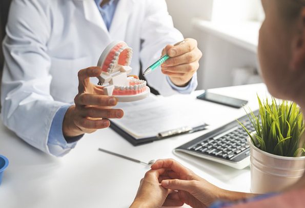 patient discussing the cost of dental implants in Everett with their dentist 