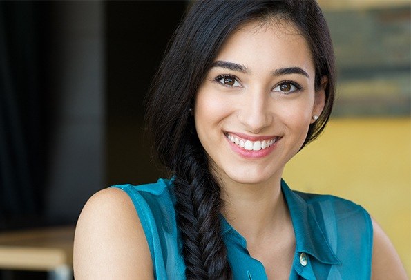 Woman with flawless smile after preventive dentistry visit