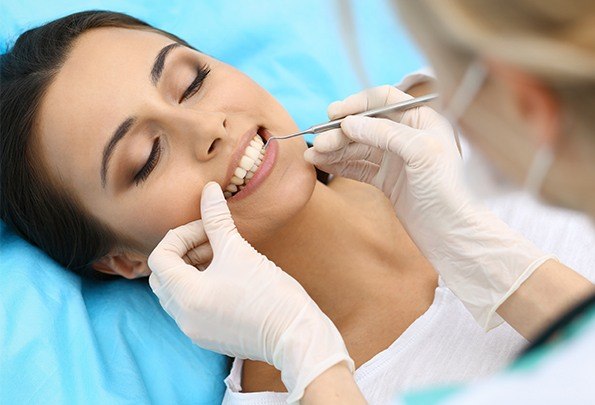 Woman receiving periodontal therapy