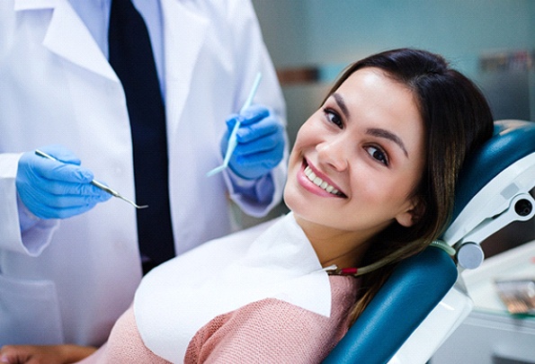 A young woman seated in the dentist’s chair in preparation for receiving sedation dentistry in Everett