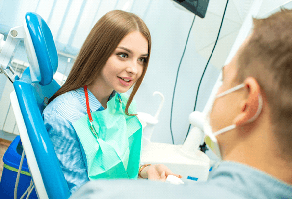 Woman at consultation with cosmetic dentist