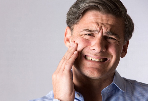 Man with jaw pain needs TMJ treatment in Everett