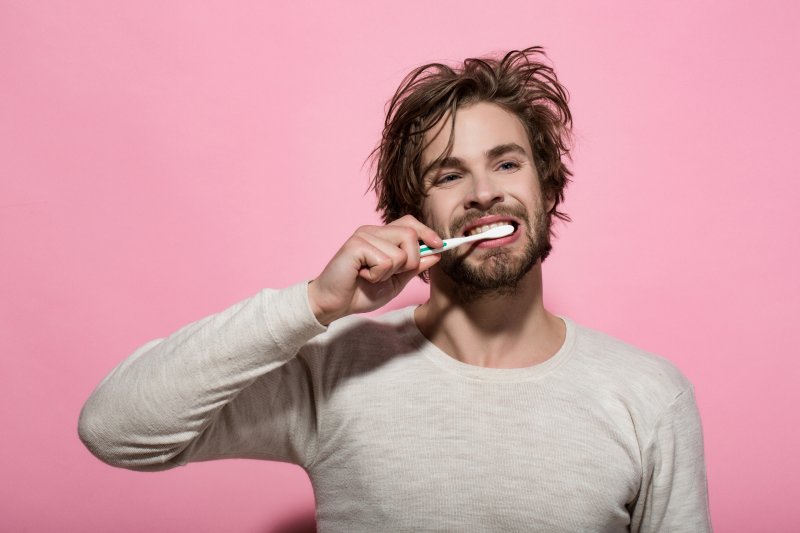 man brushing teeth in Everett