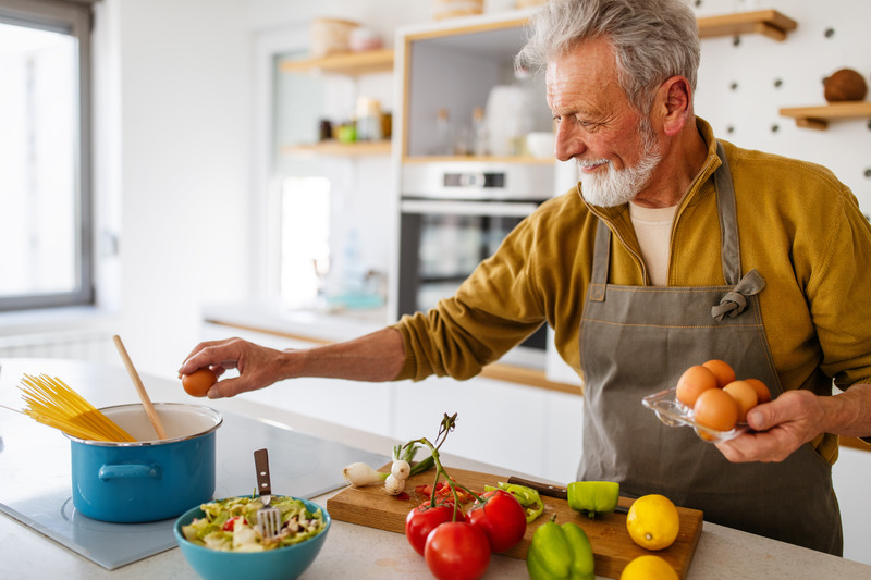 Patient cooking healthy food to fight gum disease