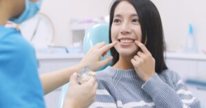 Woman at a consultation before her professional teeth whitening